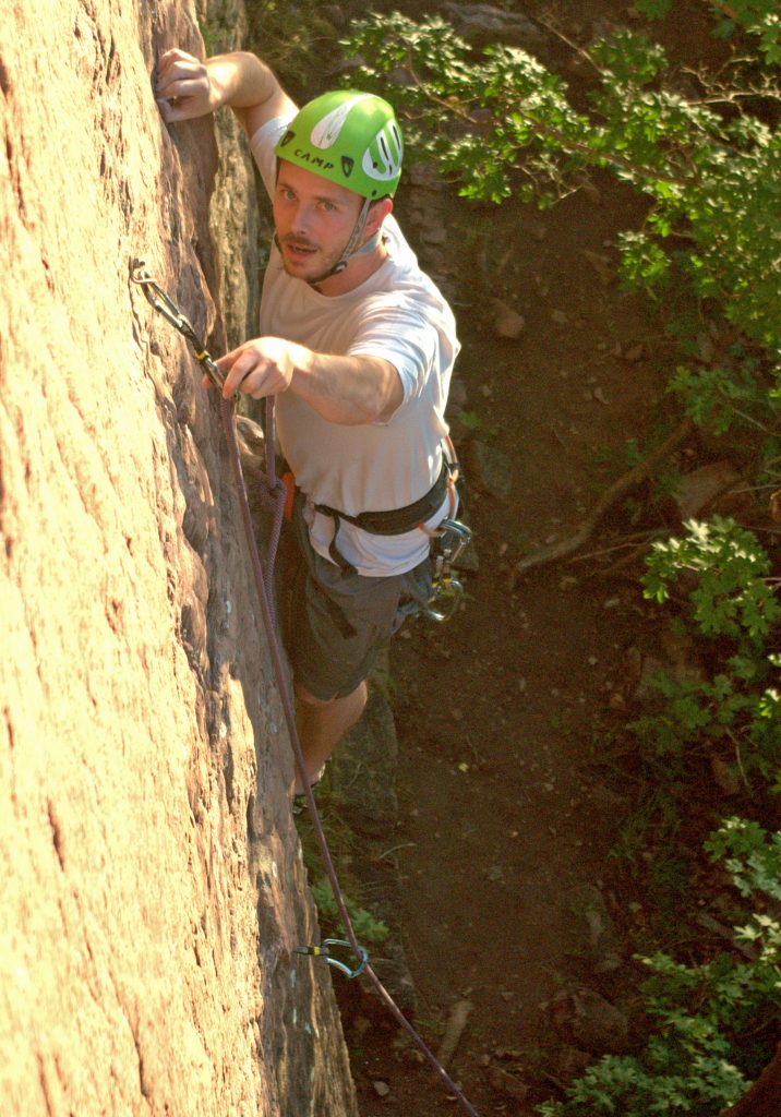 Justin Boyer rock climbing with a rope in Parley’s Canyon near Salt Lake City. In what began as Boyer’s mathematical modeling class project, he and three other University of Utah mathematicians have published a study showing the mathematical possibility of designing a climbing rope that would apply a constant force to a falling climber, bringing the climber to a gradual stop rather than hitting the end of the rope with sudden jerk. 