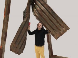 Guillermo Galindo, Angel Exterminador (wall gong), 2015, discarded old border wall section.