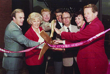 Spencer F. Eccles (far left) led the successful campaign to raise funds for the original Alumni House, which opened with this ribbon-cutting ceremony in 1980. Also pictured, from left to right: Afton B. Bradshaw, R.J. Snow, Howard A. Jorgensen, U President David P. Gardner, Anne Decker, and D. Brent Scott.