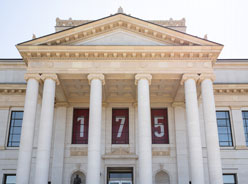The University of Utah Park Building with red banners celebrating the university's 175th anniversary.