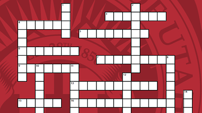 A crossword grid with the University of Utah seal in the background